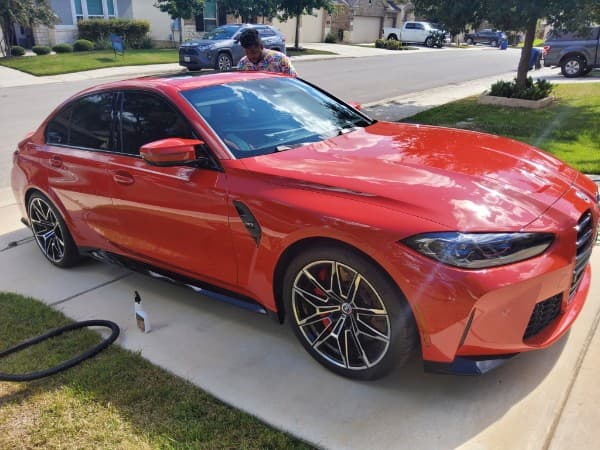 Luxury car detailing result showing deep shine and protection