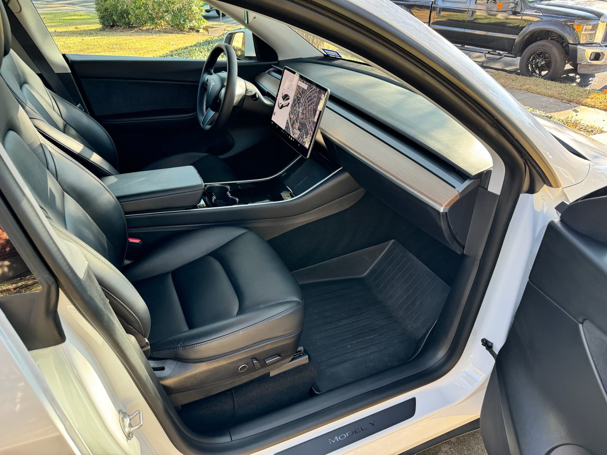 Interior detailing service showing a vehicle interior being cleaned and conditioned
